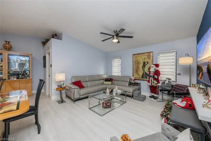 Living area featuring wood finished floors and ceiling fan