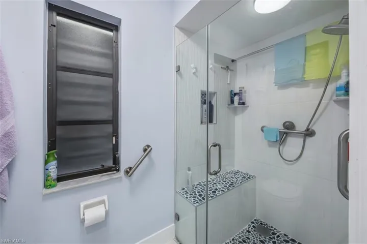 Full bath featuring a stall shower