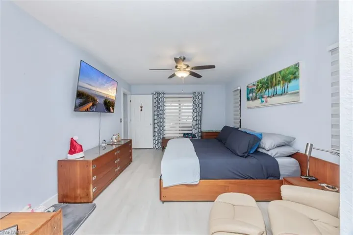 Bedroom featuring a ceiling fan and wood finished floors