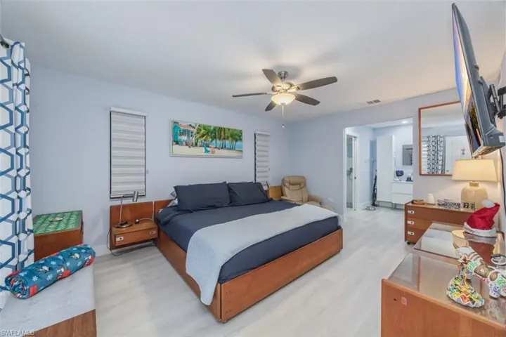 Bedroom with a ceiling fan and wood finished floors