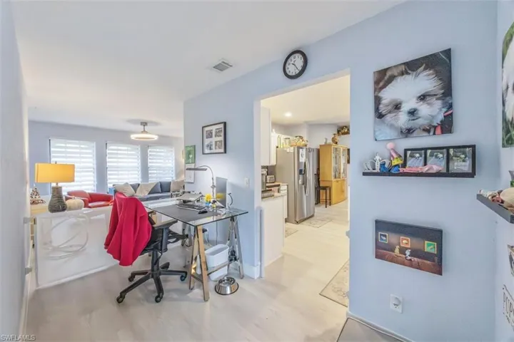 Office space featuring light wood-type flooring