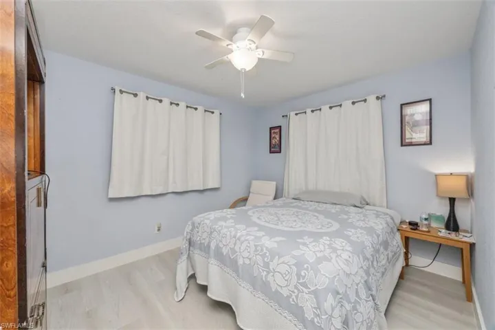 Bedroom featuring wood finished floors and a ceiling fan
