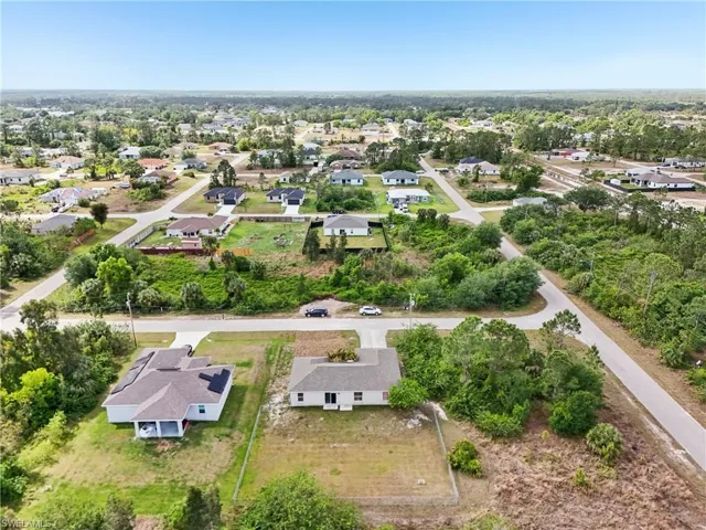 Birds eye view of property with a residential view