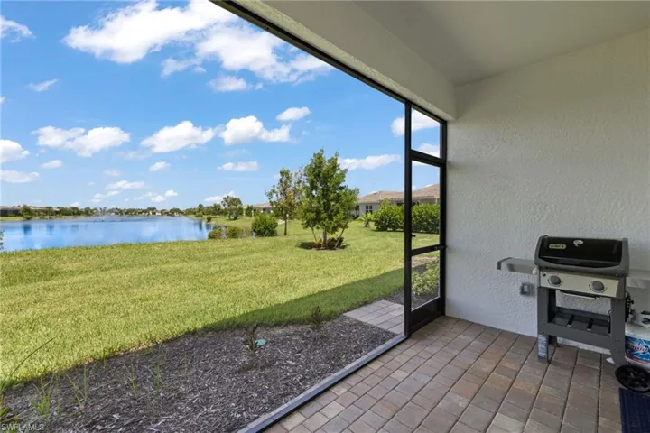 Sunroom / solarium with a water view
