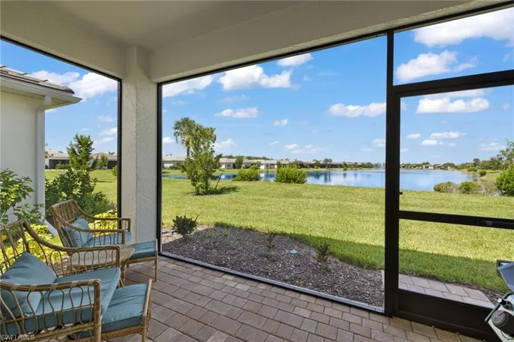 Sunroom / solarium featuring a water view and a wealth of natural light