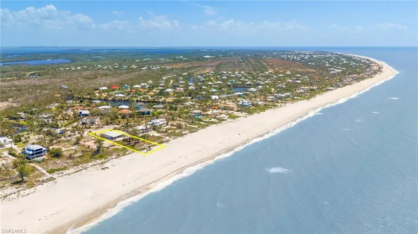 Aerial view featuring a view of the beach and a water view