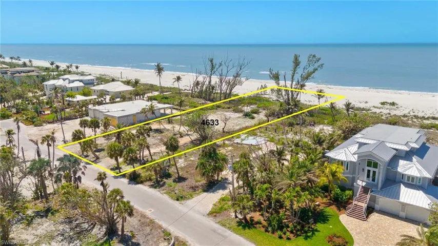 Drone / aerial view with a beach view and a water view