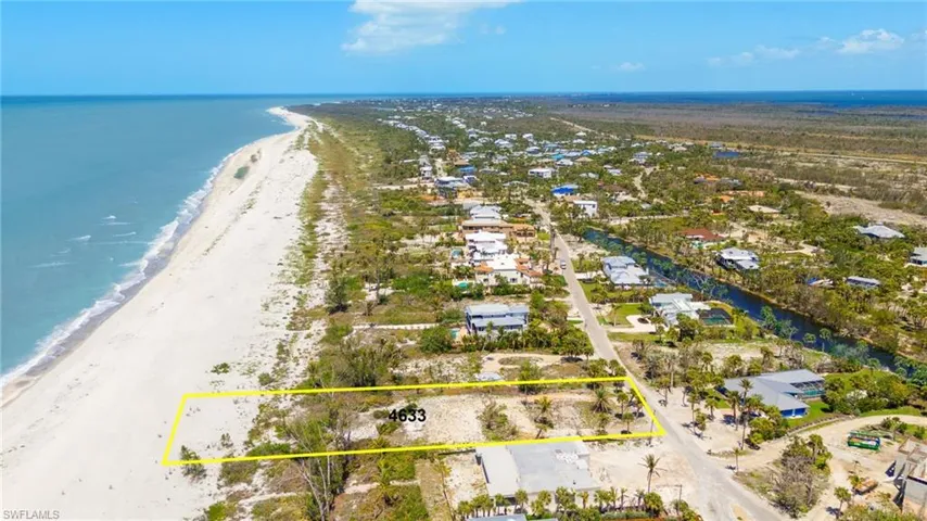 Aerial view with a view of the beach and a water view