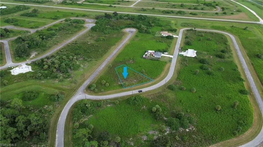 Aerial view of property and surrounding area featuring rural landscape