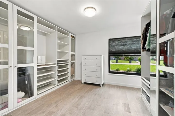 Primary closet- expansive walk in with window
