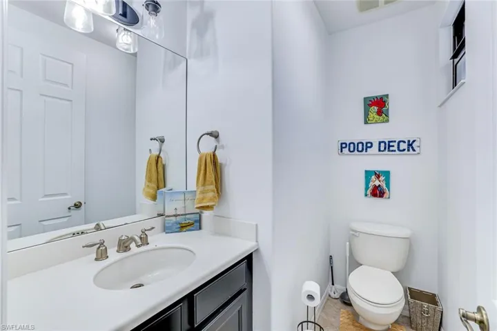 Half bath with vanity and toilet