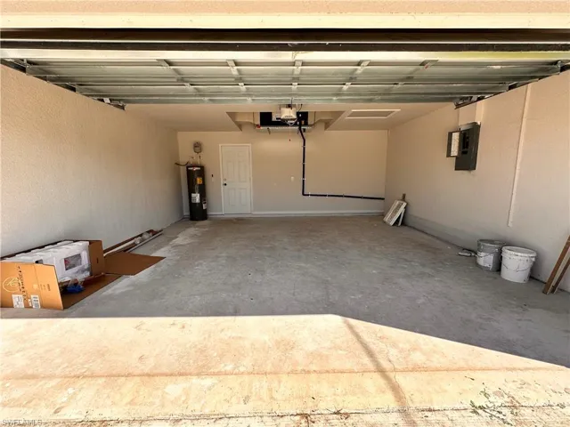 Garage with electric panel and electric water heater