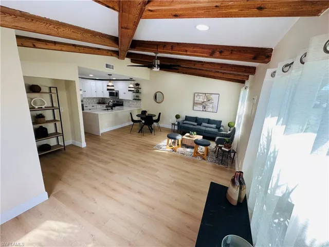Living area featuring light wood-style floors, recessed lighting, and ceiling fan