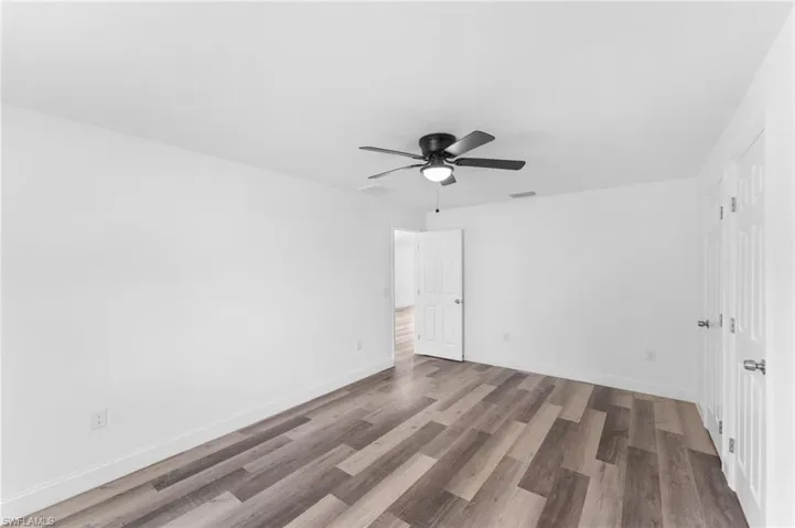 Unfurnished bedroom with light wood-style flooring and a ceiling fan
