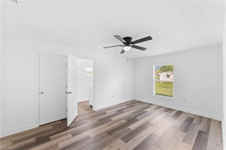 Unfurnished bedroom featuring ceiling fan and light wood-style floors