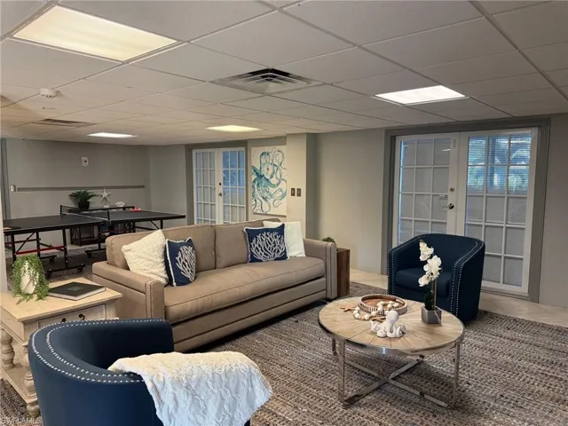 PREVIOUSLY STAGED VIEW:1st floor inside off of pool, ping pong table and game table
