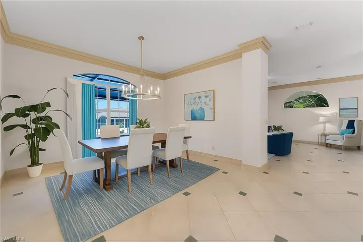 Virtually Staged: Dining area with crown molding.