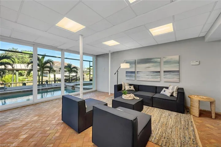 PREVIOUSLY STAGED VIEW:Inside area off of pool