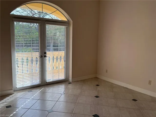 Tiled 2 bedroom with french doors to porch area and front entrance stairs