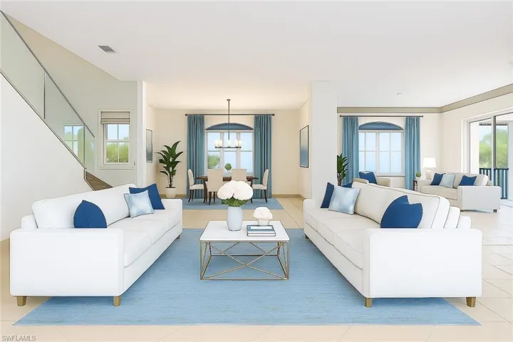 Virtually Staged: Living room with light tile patterned floors, healthy amount of natural light, and a chandelier