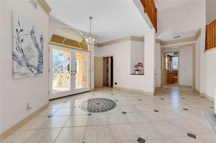 ACTUAL VIEW OF ENTRY WAY AND ELEVATOR AND HALLWAY