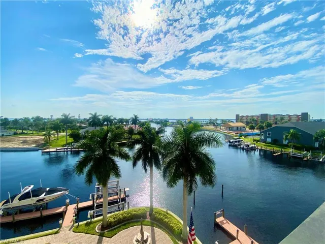 Property view of water with a dock