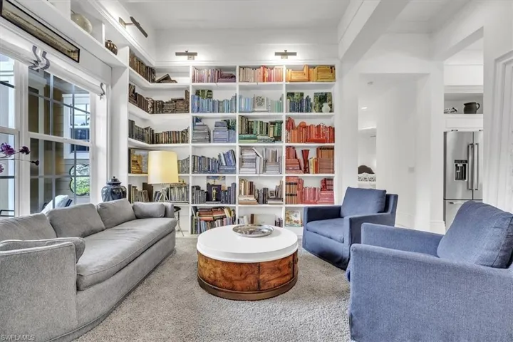 Left off foyer. All but 50 books can remain with in the library.