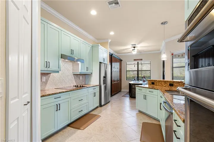 The nook cabinets have been painted blue to match the kitchen.