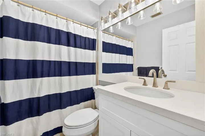 Bathroom with vanity and a shower with curtain