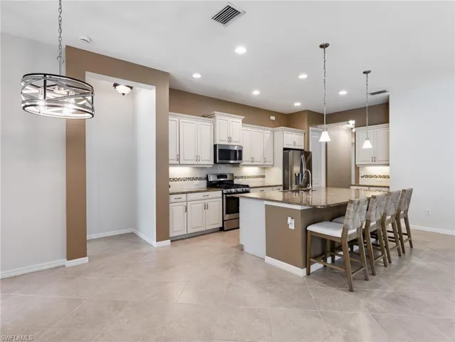 The gourmet inspired Kitchen has plenty of storage and counter space.