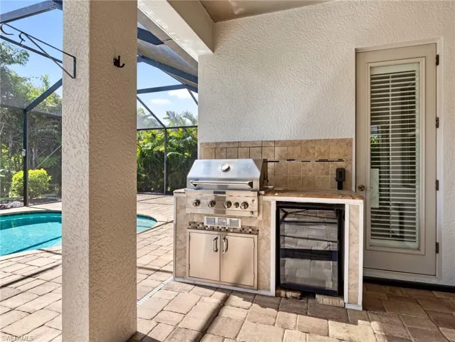 The convenience of a built-in stainless grill and beverage chiller.