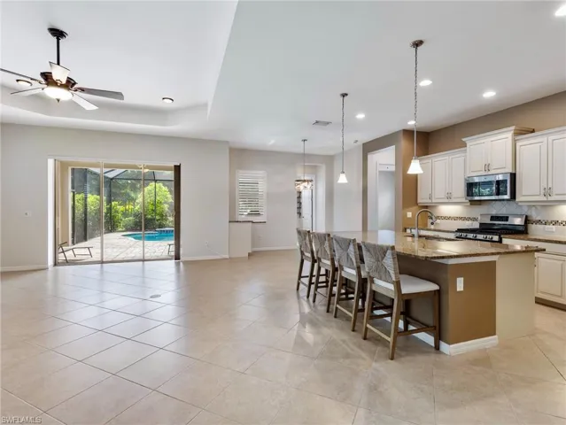 A classic Kitchen with granite counters and stainless appliances.