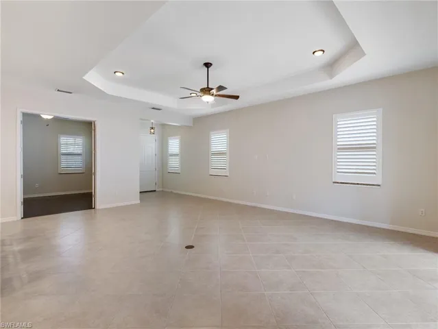Light and bright Great Room with Plantation Shutters.  Office/Den has French Doors and wood flooring.