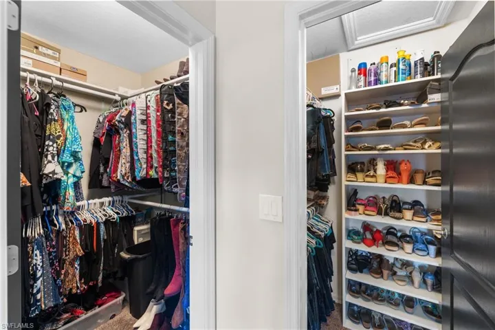 Walk in closet featuring carpet