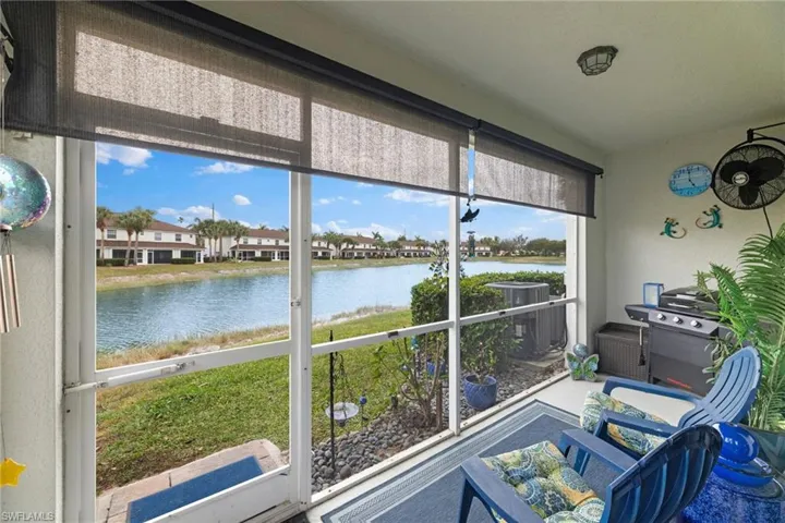 Sunroom / solarium featuring a water view and a wealth of natural light