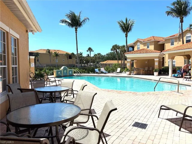 Community pool featuring a patio area