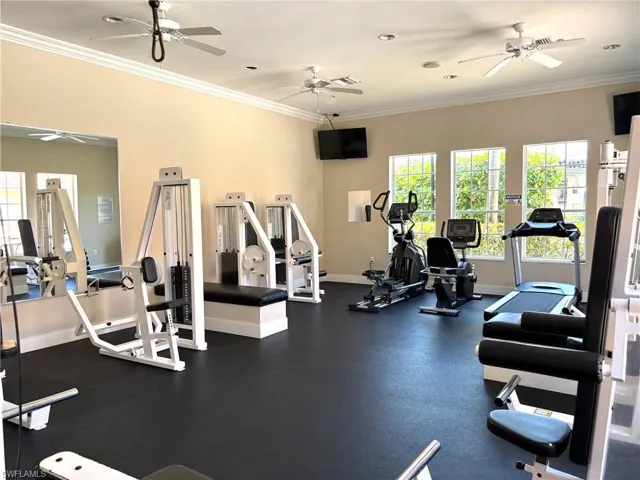 Workout area featuring ornamental molding, ceiling fan, and recessed lighting