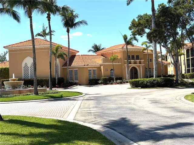 View of building exterior with curved driveway