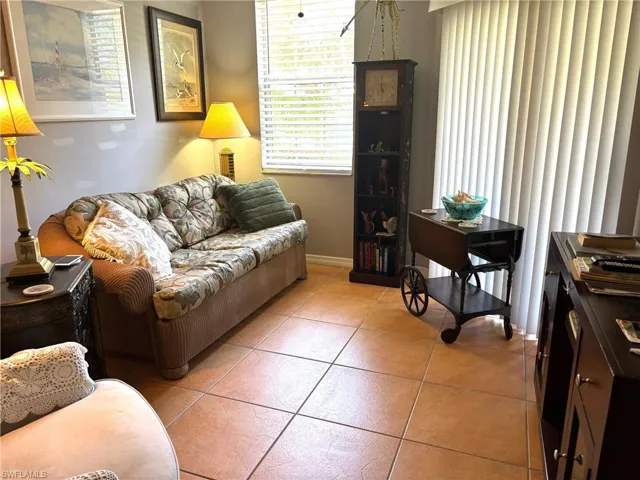 Living room with light tile patterned floors
