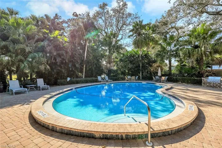 One of six community pools featuring a patio area