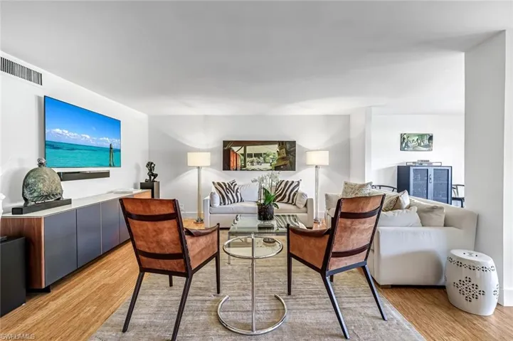 Great room with two sitting areas, dining area and course views!