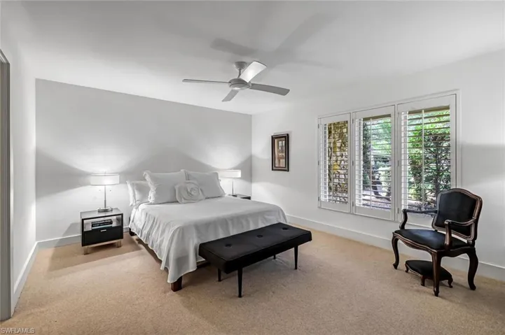 Primary en-suite bedroom with plantation shutters