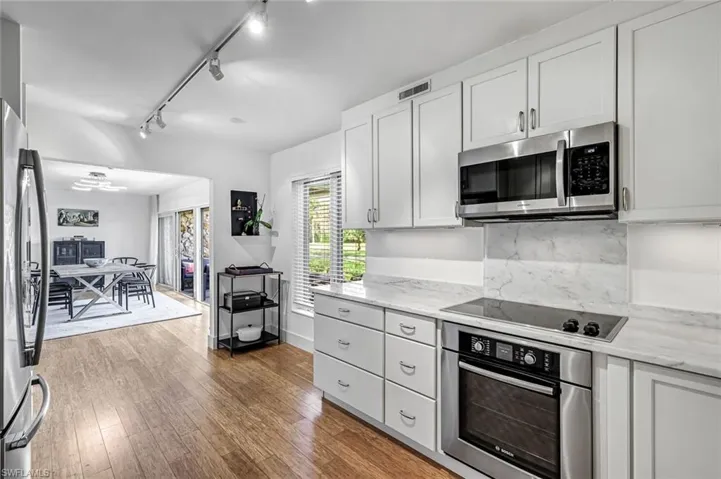 Kitchen featuring high end stainless steel appliances