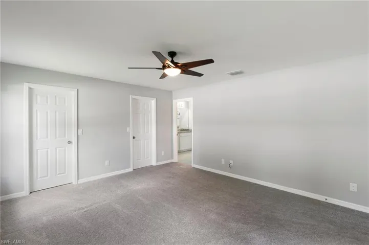 Primary Suite features an ensuite Bathroom, Walk-In Closets and comfortably fits a king size bed!