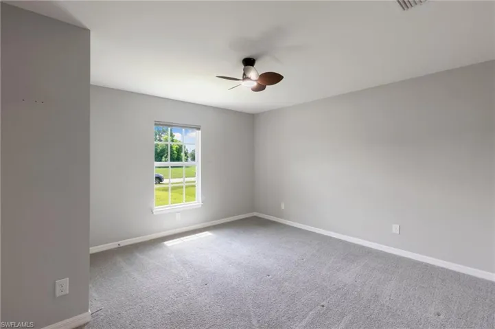 A large fully carpeted Guest Bedroom with plenty of natural light!