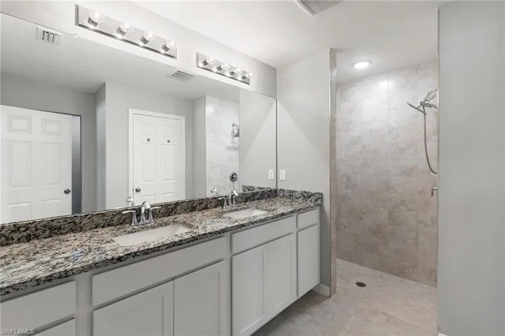 Primary Bath with Dual Sinks, Moen Fixtures & Spacious Walk in Shower