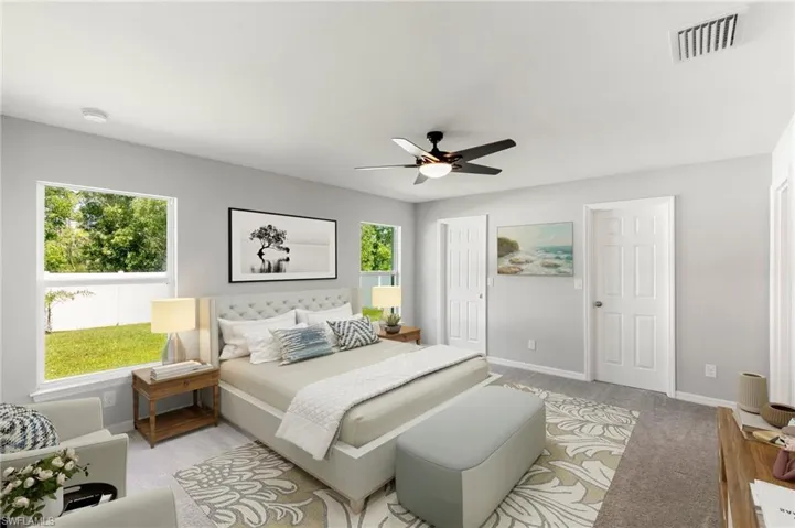 Unwind in the large Primary Suite complete with two Walk In Closets