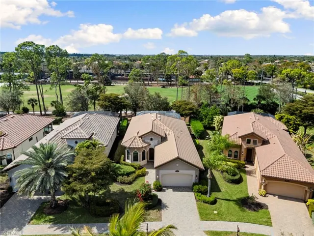 Aerial perspective of suburban area with a golf course
