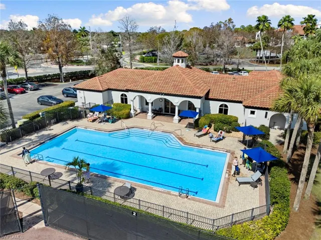 Community pool with a patio