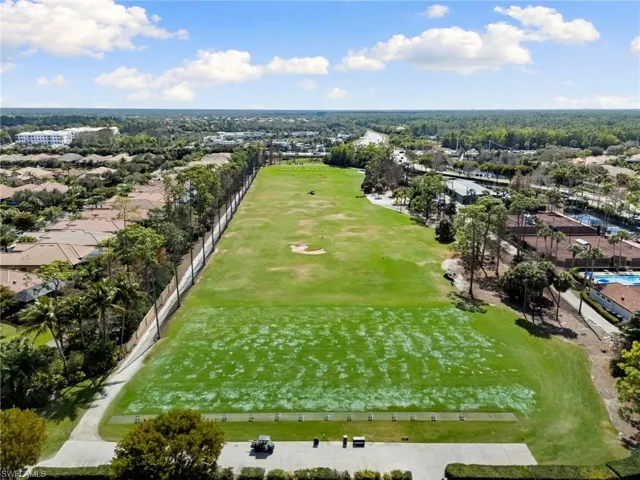 Aerial perspective of suburban area featuring a golf club